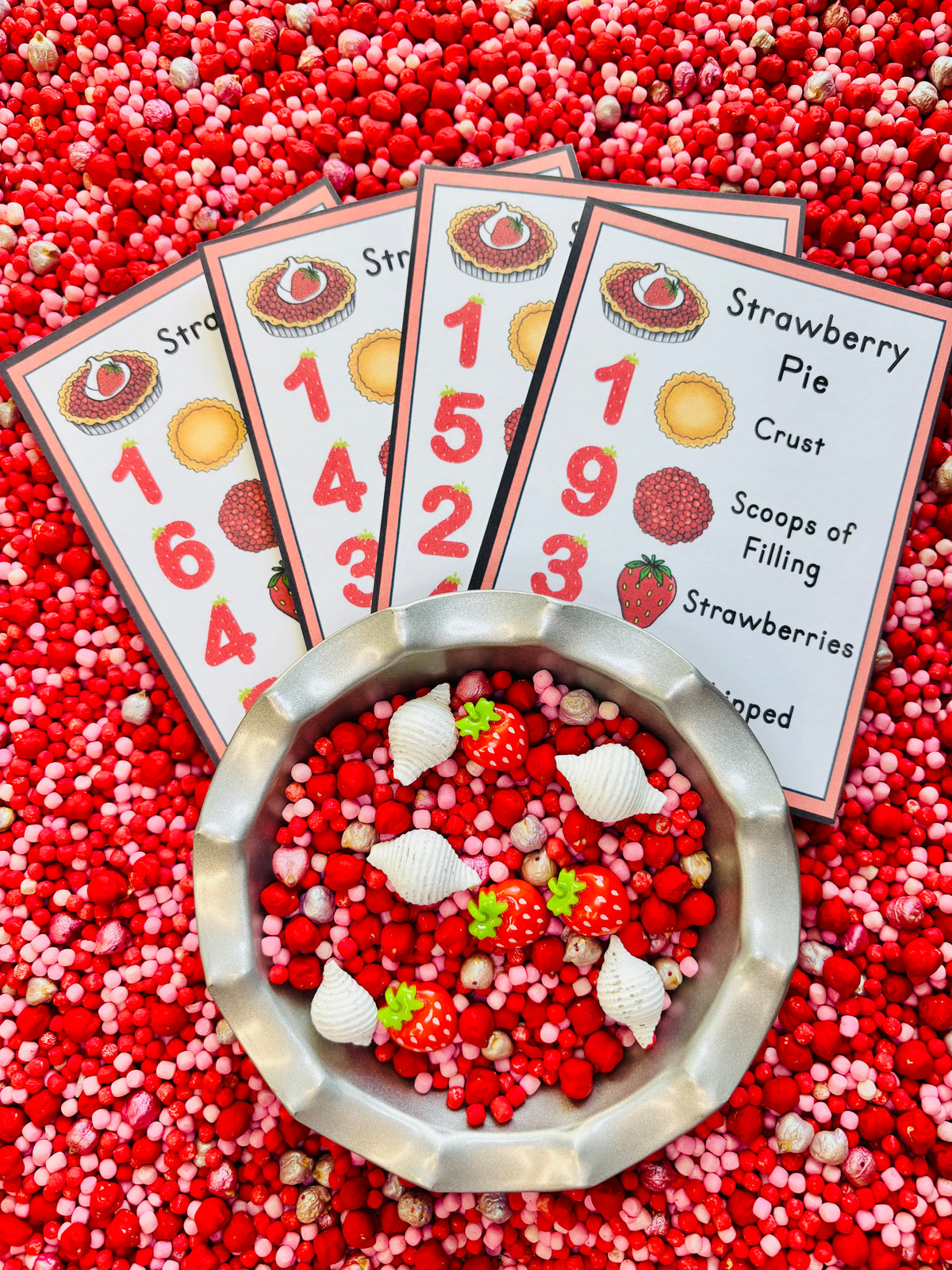 Strawberry recipe cards for sensory play and early math activities.