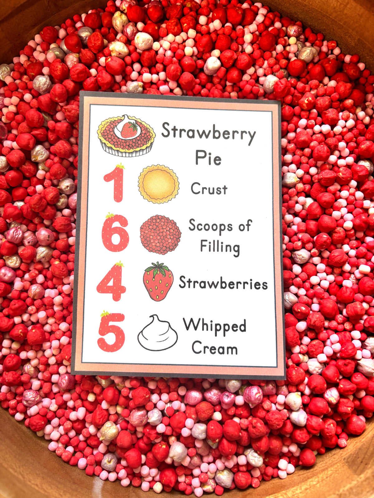 Preschool strawberry sensory activity with counting card and hands-on learning materials.